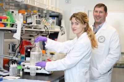 Kristin Eden in the lab with Phd advisor Irving Coy Allen